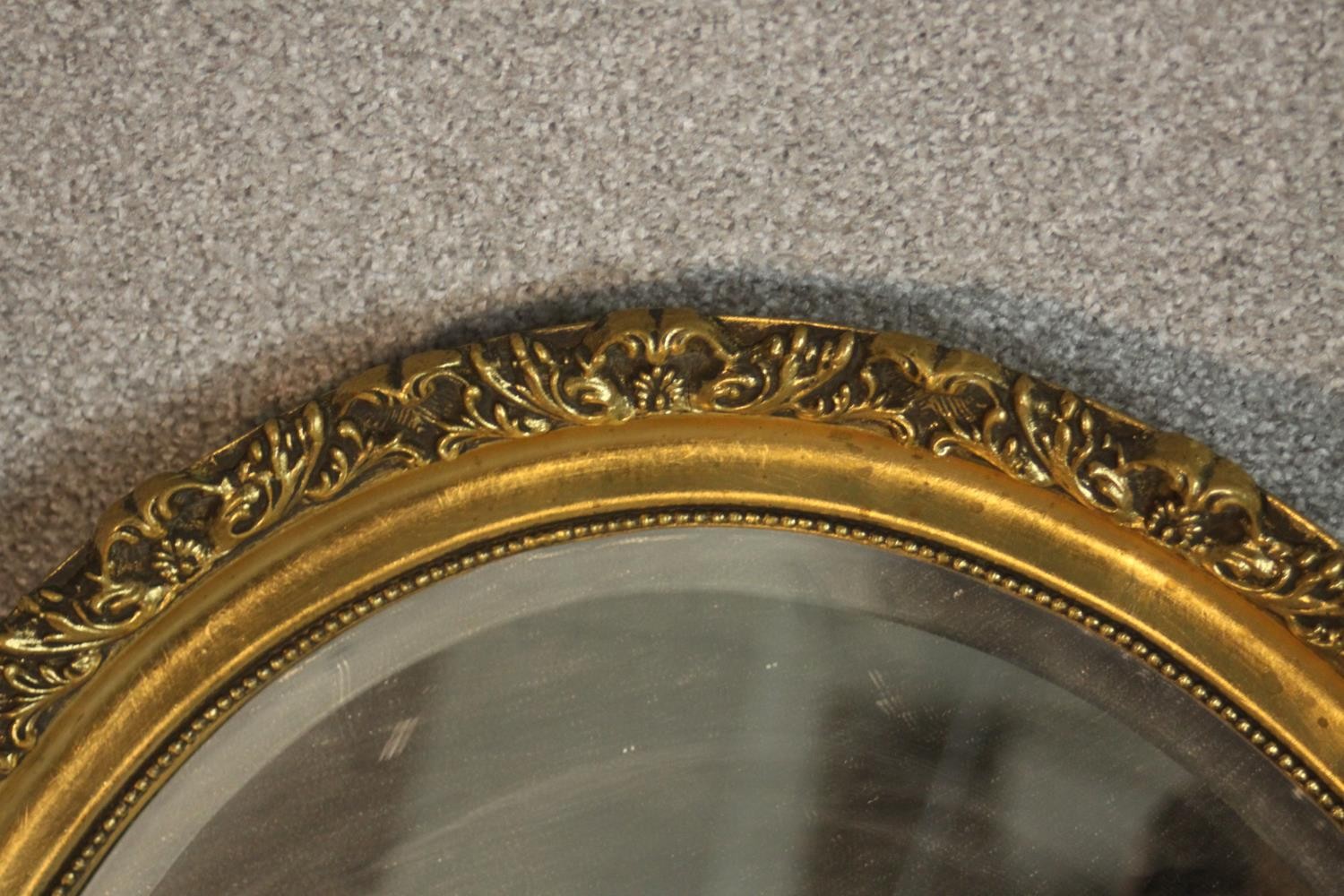 Two oval wall mirrors, one ebonized and one gilt framed. H.68 W.54cm. (largest) - Image 3 of 7