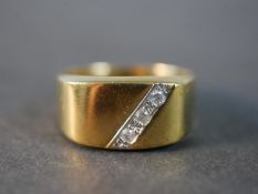 A 9 carat yellow gold and diamond signet style dress ring, set with three round brilliant cut