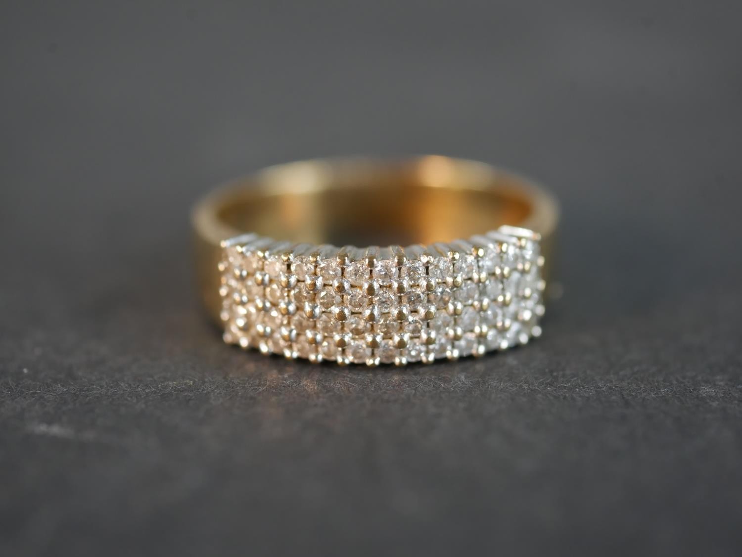 A 9 carat yellow gold diamond set dress ring, set with fifty two round eight cut diamonds with a