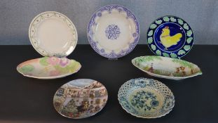 A collection of seven plates, including a Meissen blue onion pattern plate. Diam.29cm (largest)