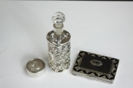 An onyx and marcasite inlaid Art Deco style silver card case along with a white metal (tests as