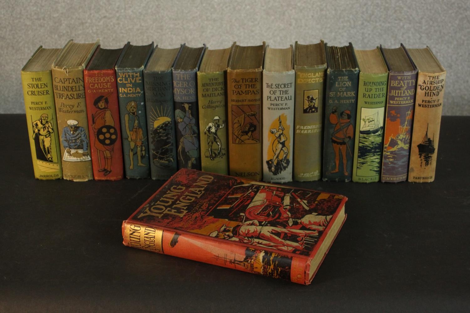 A collection of fourteen early 20th Century ‘Blackie’ boys novels all with decorated covers. Various