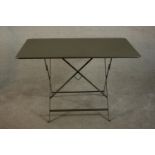 A contemporary painted metal folding table, the rectangular top with rounded corners. H.72 W.117 D.