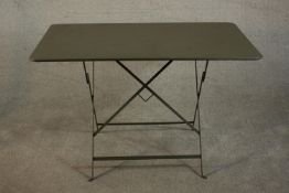 A contemporary painted metal folding table, the rectangular top with rounded corners. H.72 W.117 D.