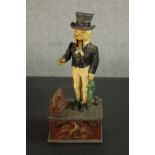 A vintage style cast iron money box in the form of Uncle Sam smoking a cigar. H.28 W.13cm.