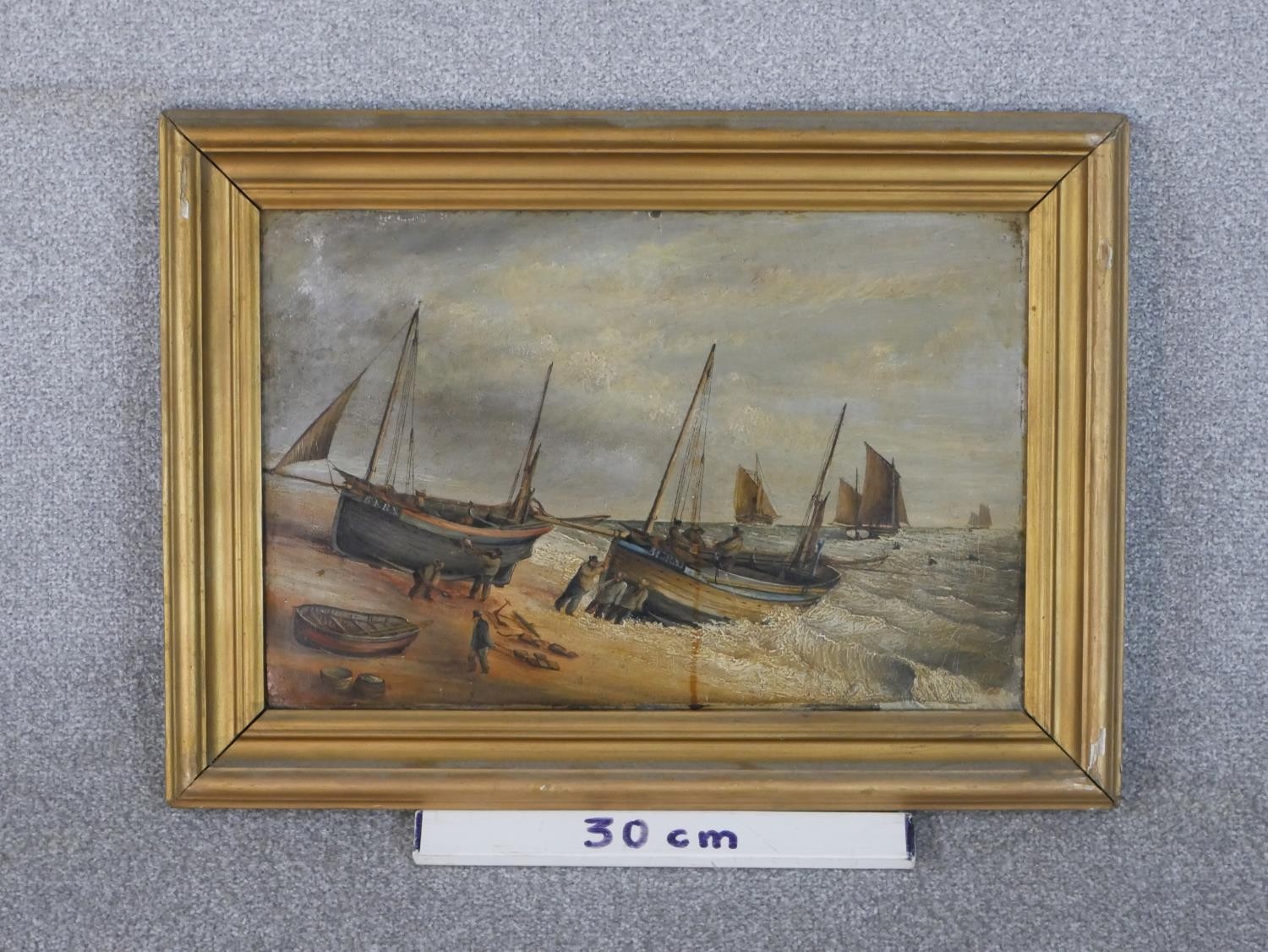 A gilt framed 19th century oil on board of fishermen pushing their boats out to sea, unsigned. H. - Image 3 of 4