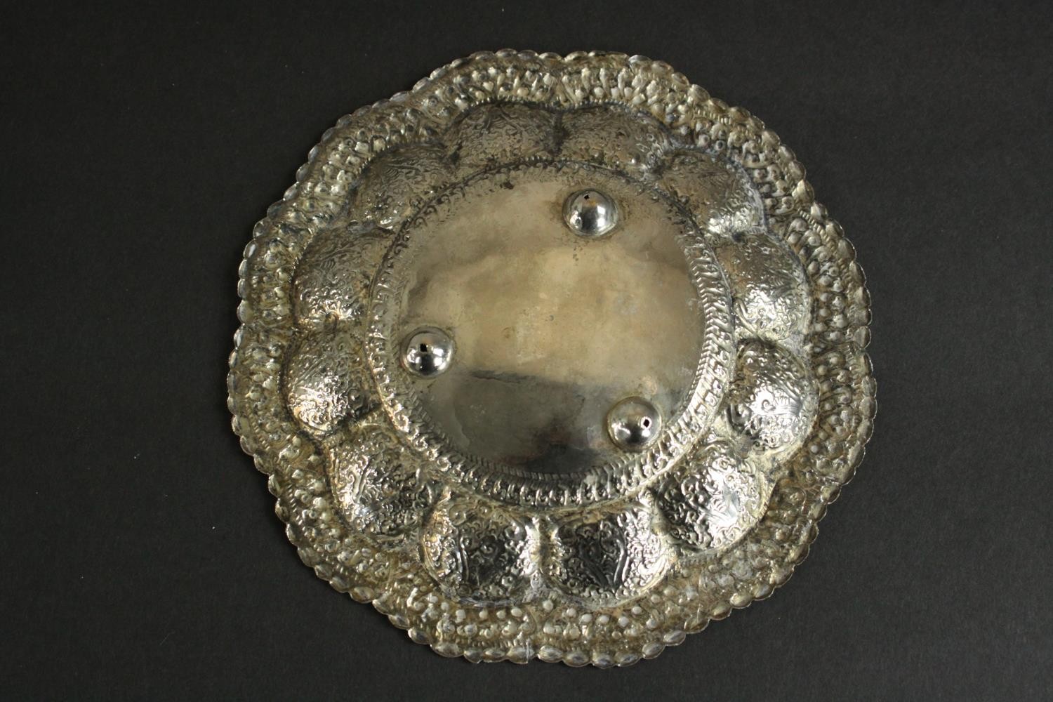 Three Oriental silver and white metal pieces, including a repousse design floral form dish on - Image 5 of 16