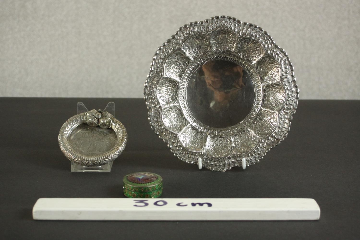 Three Oriental silver and white metal pieces, including a repousse design floral form dish on - Image 2 of 16