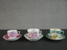 Two 19th century Sunderland pink lustre tea cups and saucers, one cup and saucer titled 'Faith'