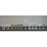 A collection of 19th and 20th century glasses including a set of six faceted stem liqueur glasses,