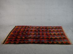 A hand made multicoloured Tulu rug from Turkey. L.197 x W.122cm