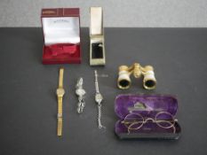 Three vintage ladies cocktail watches along with a pair of opera glasses and gold plated spectacles.