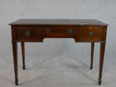 A George III style Edwardian mahogany and line inlaid side table, with three short drawers on square