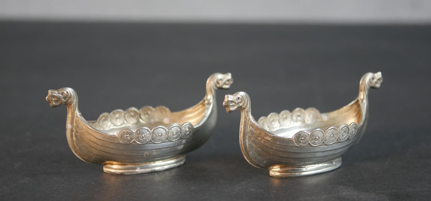 A pair of Norwegian silver salts in the form of viking boats. Stamped 60GRHS. Weight 45g