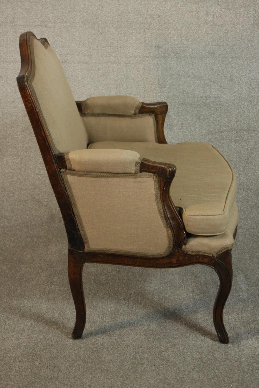 A French Louis XV provincial walnut fauteuil á la reine, with carved floral apron, cabriole legs, - Image 4 of 9