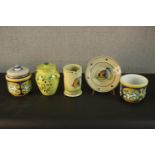 A collection of Portuguese and Italian hand painted pottery, including a Majolica planter and two