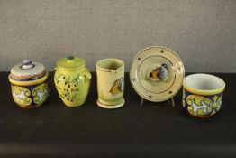 A collection of Portuguese and Italian hand painted pottery, including a Majolica planter and two