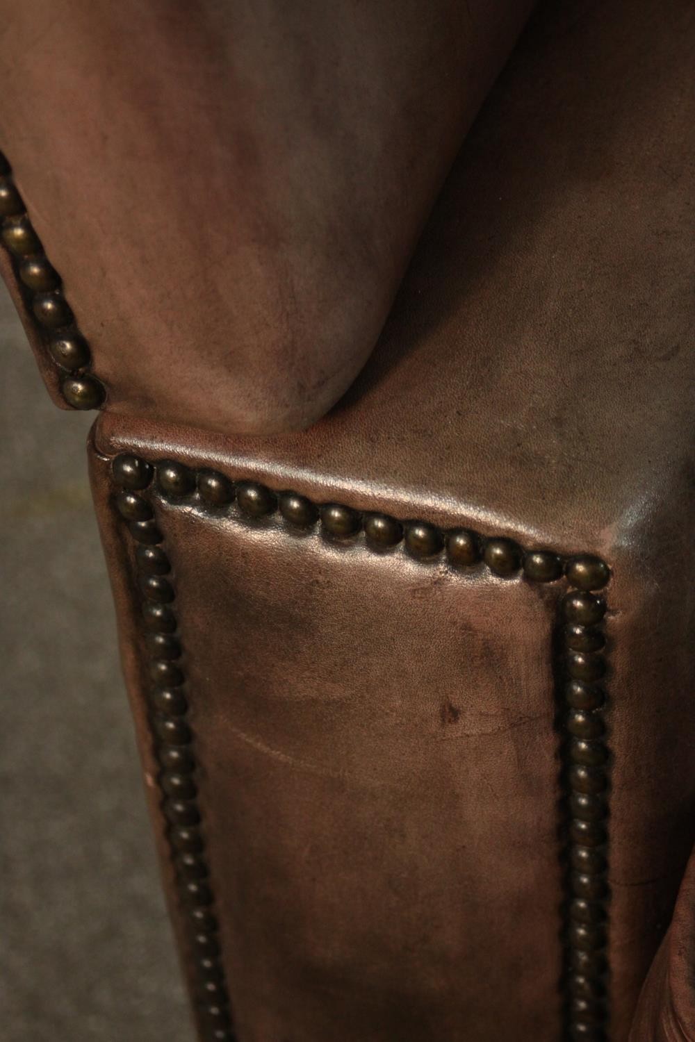 A Knole style contemporary brown leather armchair, with turned stained beech finials and studded - Image 9 of 12