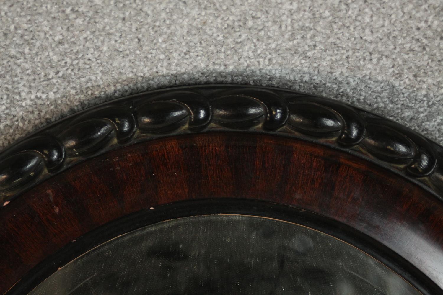 Two oval wall mirrors, one ebonized and one gilt framed. H.68 W.54cm. (largest) - Image 6 of 7