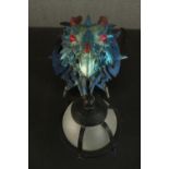 A moulded metallic painted dragon head wall lamp with caged frosted glass globe shade. H.33 W.23 D.