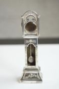 An engraved miniature white metal (tests as silver) grandfather clock watch case with moving