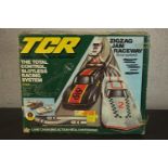 A vintage TCR race game, Zigzag Jam Raceway, complete with three cars. H.12 L.59 W.48cm. (box)