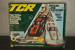 A vintage TCR race game, Zigzag Jam Raceway, complete with three cars. H.12 L.59 W.48cm. (box)