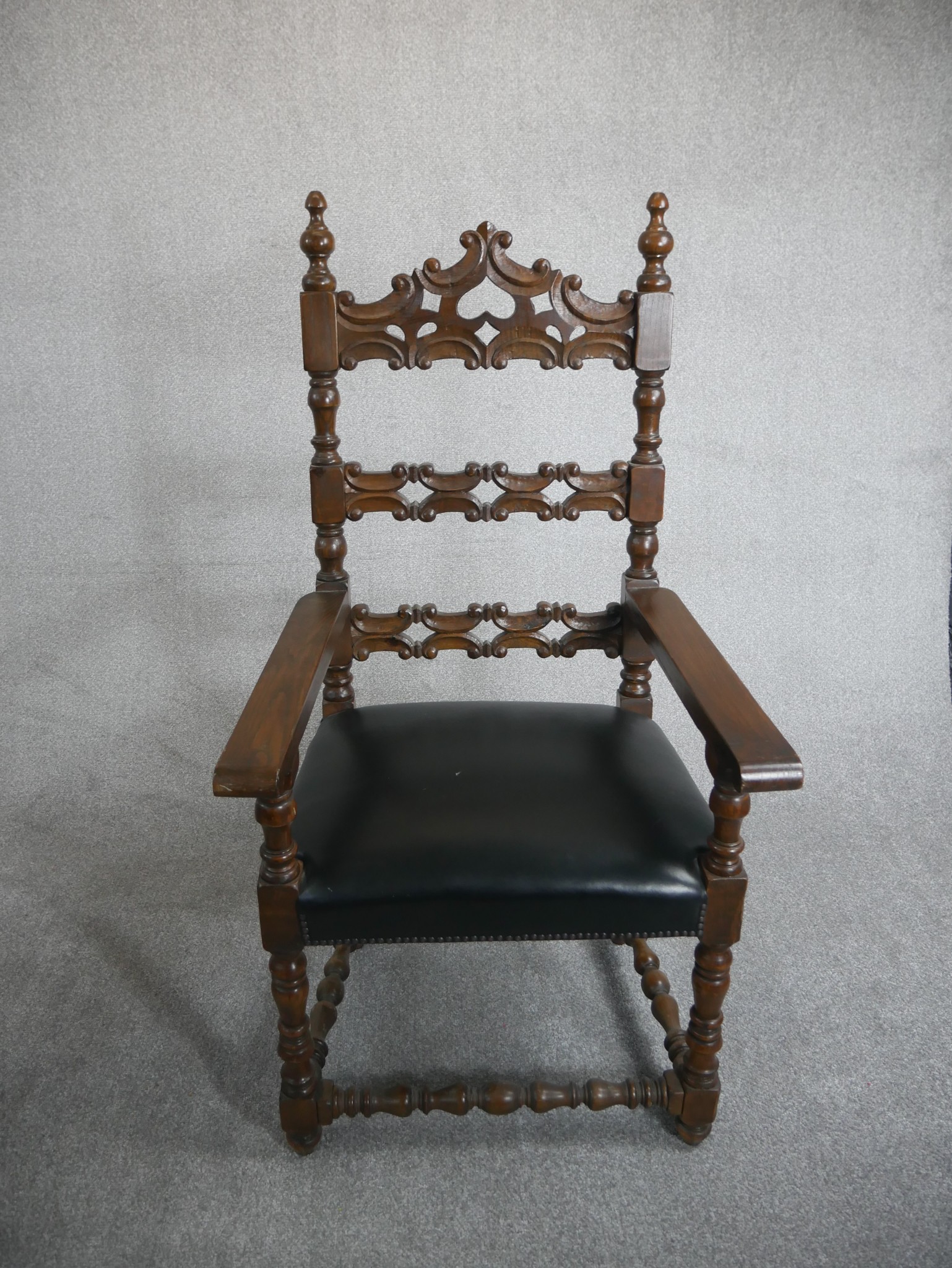 A pair of Spanish walnut ladder back carvers, the back carved with C scrolls over a black leather - Image 2 of 4