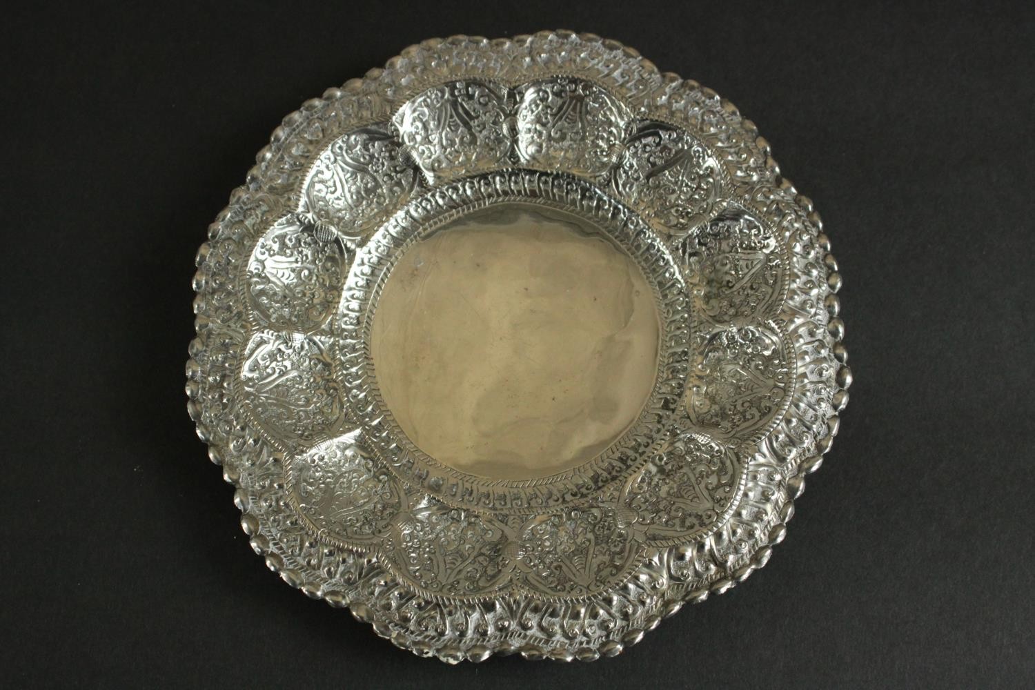 Three Oriental silver and white metal pieces, including a repousse design floral form dish on - Image 4 of 16