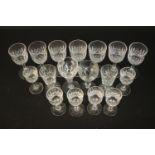 A collection of seventeen pressed glass and cut crystal sherry/liqueur glasses with various