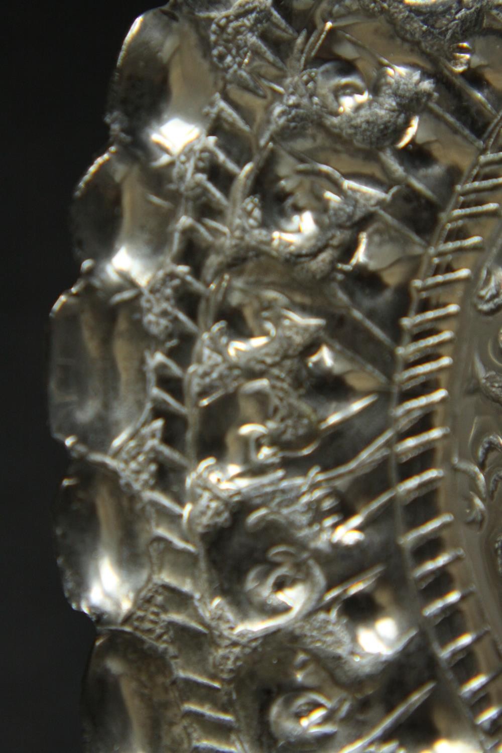 Three Oriental silver and white metal pieces, including a repousse design floral form dish on - Image 13 of 16