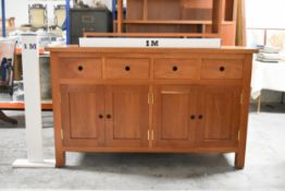 A contemporary hardwood sideboard with two drawers above panel doors on block supports. H.91 x W.150