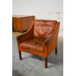 Borge Mogensen, a model 2207 club armchair in tan leather. H.80 x W.73 x D.69cm
