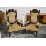 A pair of late 19th century carved walnut armchairs. H.118 x W.65 x D.65cm