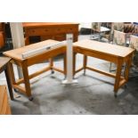 A pair of contemporary hardwood butchers block style kitchen tables fitted with frieze drawers and