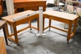 A pair of contemporary hardwood butchers block style kitchen tables fitted with frieze drawers and