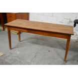 A small elm refectory dining table with planked top on square tapering supports. H.74 x W.164 x D.