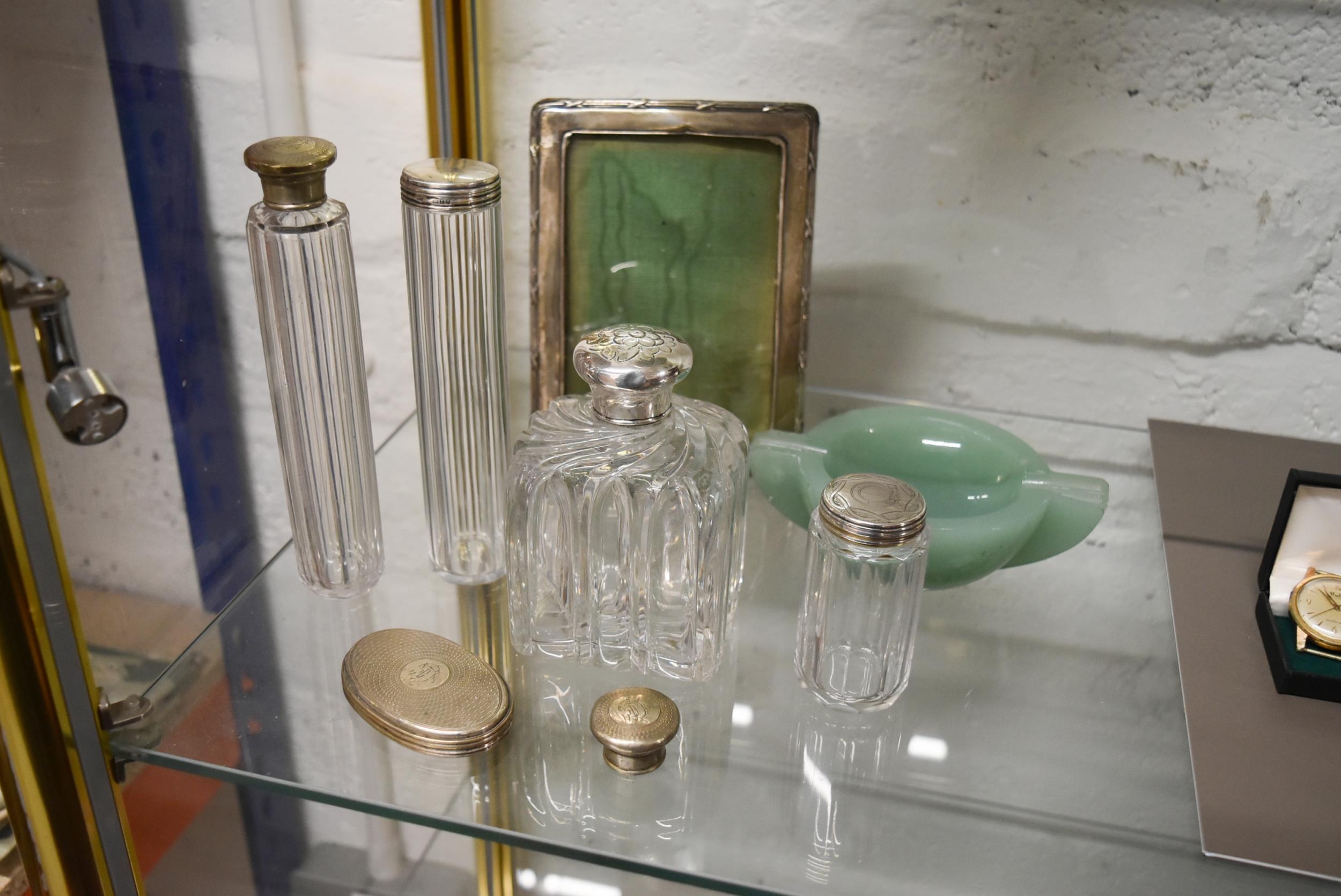 A collection of Silver Topped Bottles, Mirror and Art Deco Jadeite Ashtray