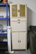 A mid century vintage painted kitchen cabinet. H.180 x W.60 x D.40cm