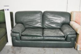 A Roche Bobois two seater sofa in deep green leather upholstery. W.150 x H.75 x D.90cm