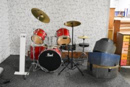A Pearl drum kit with Paiste cymbals along with stool, pedals and transport cases.