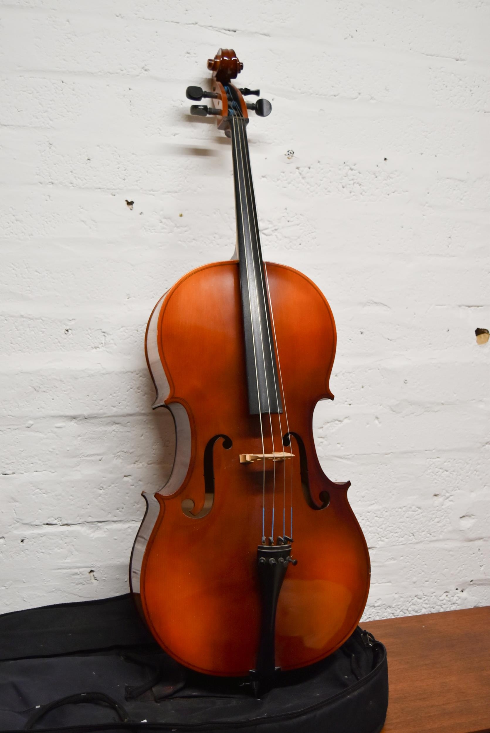 A modern cello and carrying case.