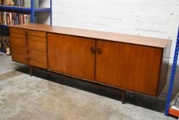 Ib Kofod-Larsen for G-Plan, a mid century teak sideboard fitted with cupboards and drawers on