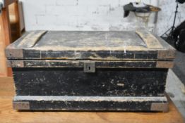 A vintage metal bound tool chest with fitted interior and a collection of vintage woodworking tools.