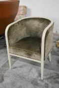 A tub armchair with painted frame in velour upholstery. H.80 x W.59 x D.55cm