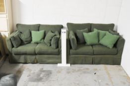 A pair of two seater sofas in green upholstery. H.73 x W.150 x D.85cm