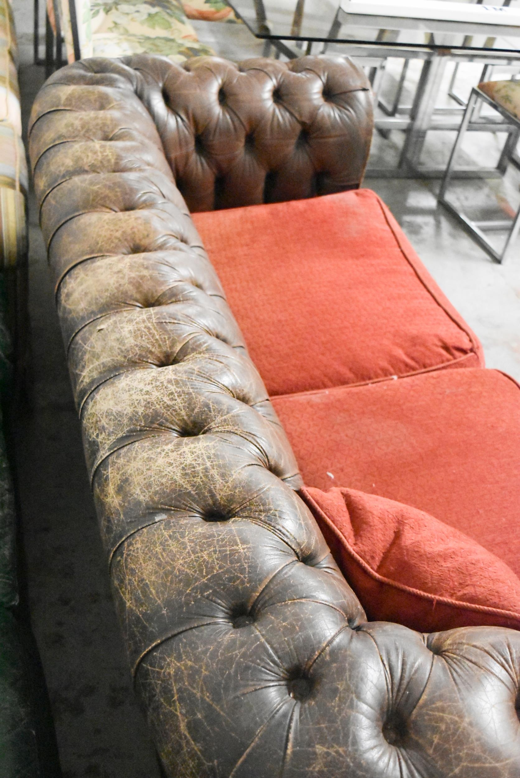 A Chesterfield two seater sofa in brown leather deep buttoned upholstery. H.70 x W.200 x D.82cm - Image 6 of 6