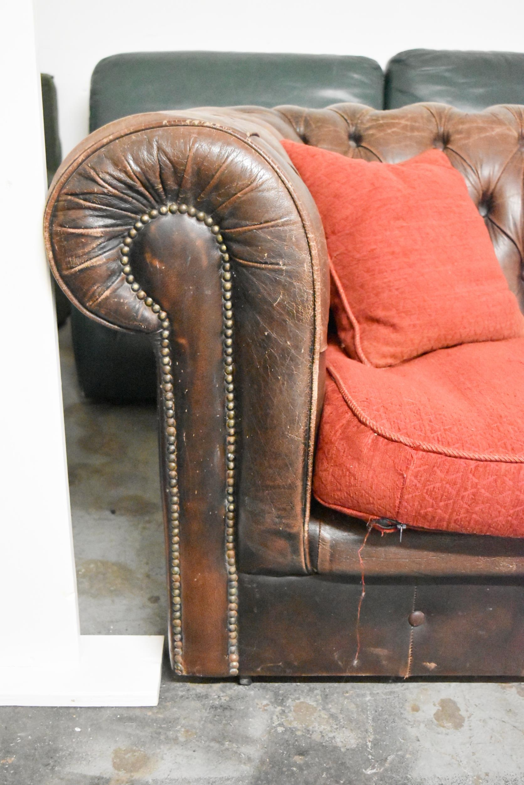 A Chesterfield two seater sofa in brown leather deep buttoned upholstery. H.70 x W.200 x D.82cm - Image 4 of 6