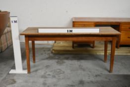 A small elm refectory dining table with planked top on square tapering supports. H.74 x W.164 x D.