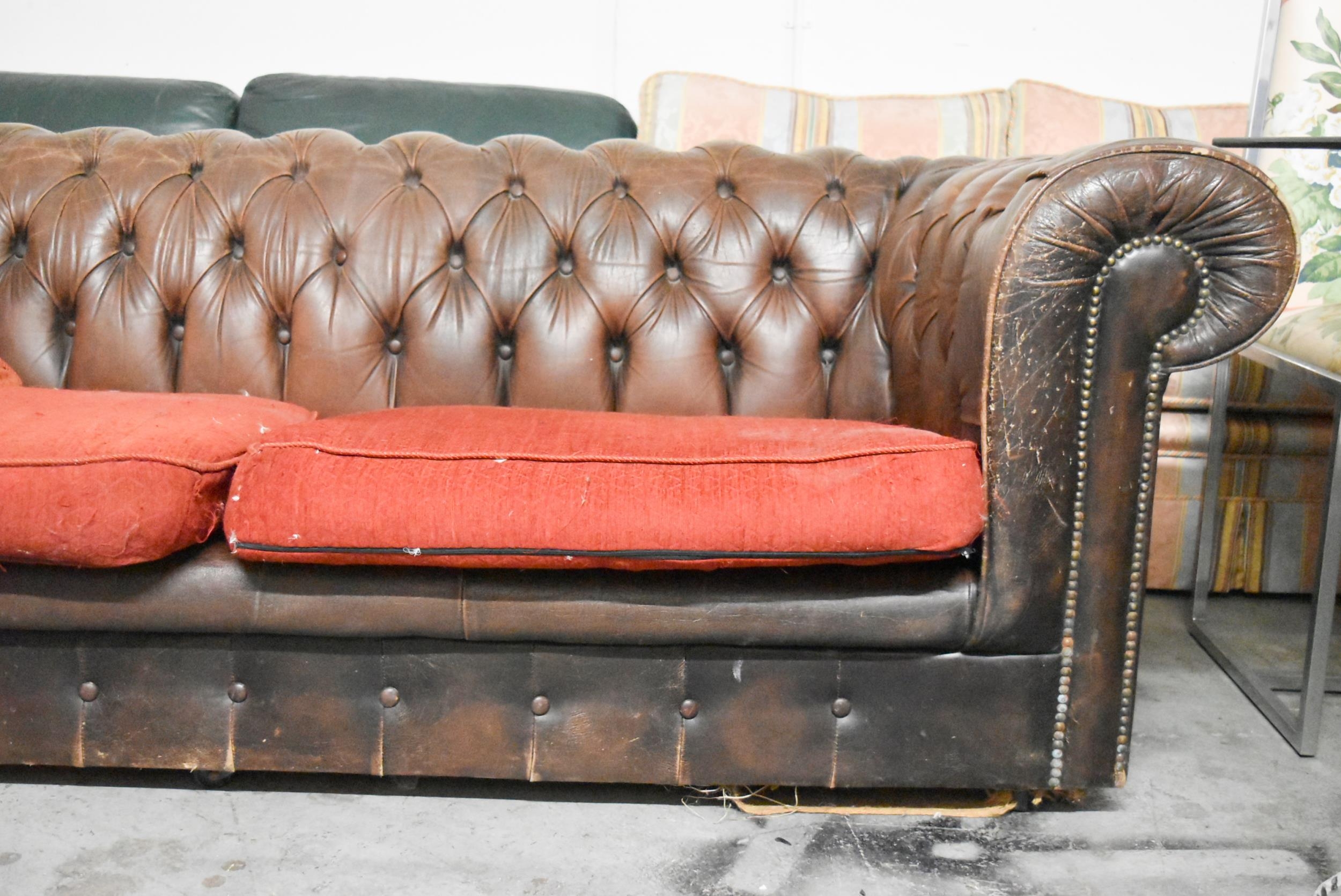 A Chesterfield two seater sofa in brown leather deep buttoned upholstery. H.70 x W.200 x D.82cm - Image 3 of 6